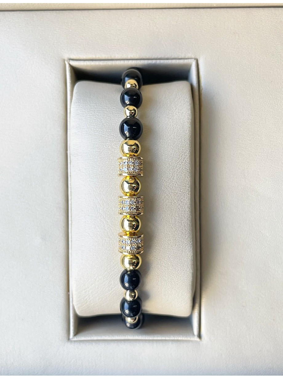 Bratara dama model deosebit cu margele aurii si negre si cercuri cu pietre stralucitoare Bratara dama model deosebit cu margele aurii si negre si cercuri cu pietre stralucitoare