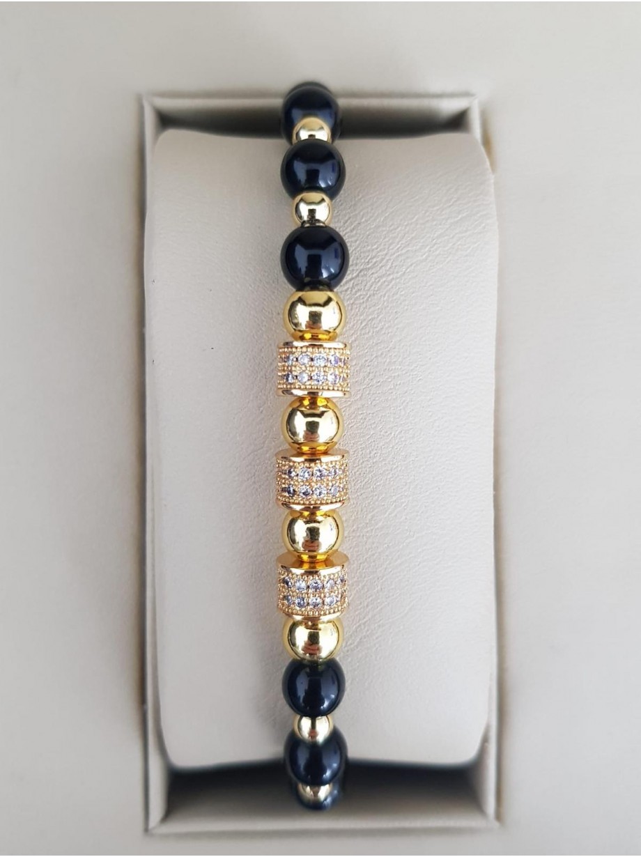 Bratara dama model deosebit cu margele aurii si negre si cercuri cu pietre stralucitoare