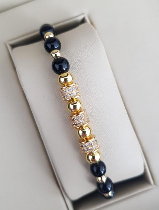 Bratara dama model deosebit cu margele aurii si negre si cercuri cu pietre stralucitoare