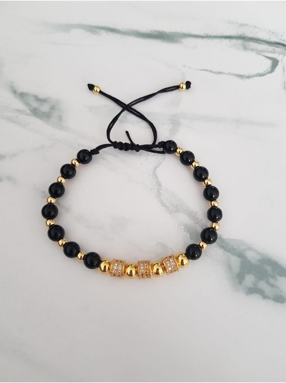 Bratara dama model deosebit cu margele aurii si negre si cercuri cu pietre stralucitoare