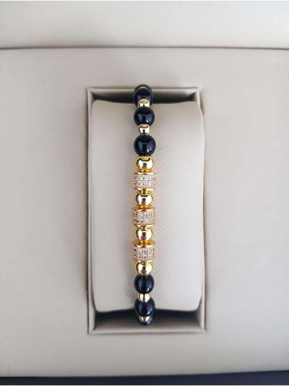 Bratara dama model deosebit cu margele aurii si negre si cercuri cu pietre stralucitoare