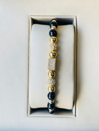 Bratara dama model deosebit cu margele aurii si negre si forme cu pietricele stralucitoare