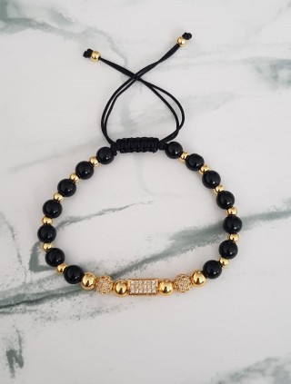 Bratara dama model deosebit cu margele aurii si negre si forme cu pietricele stralucitoare