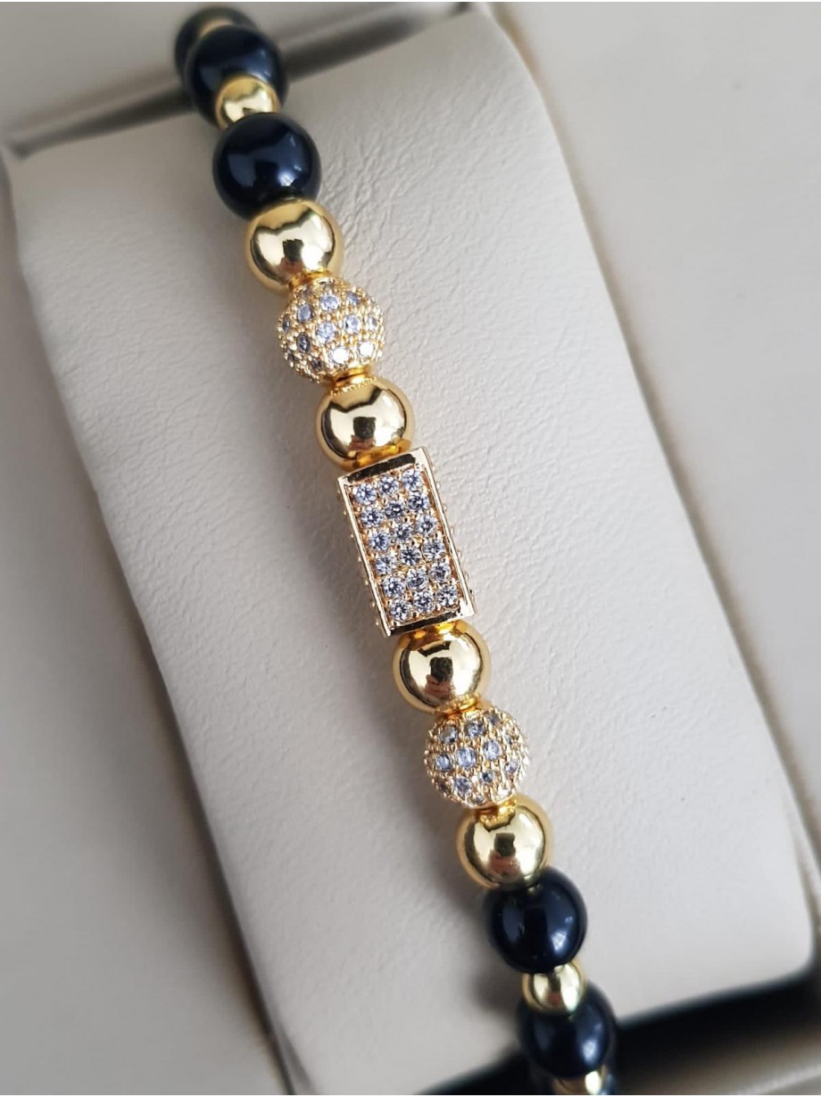 Bratara dama model deosebit cu margele aurii si negre si forme cu pietricele stralucitoare