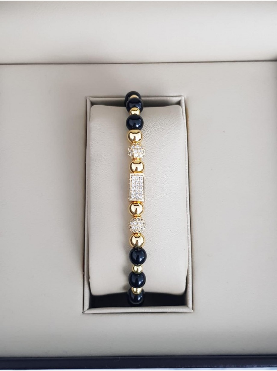 Bratara dama model deosebit cu margele aurii si negre si forme cu pietricele stralucitoare