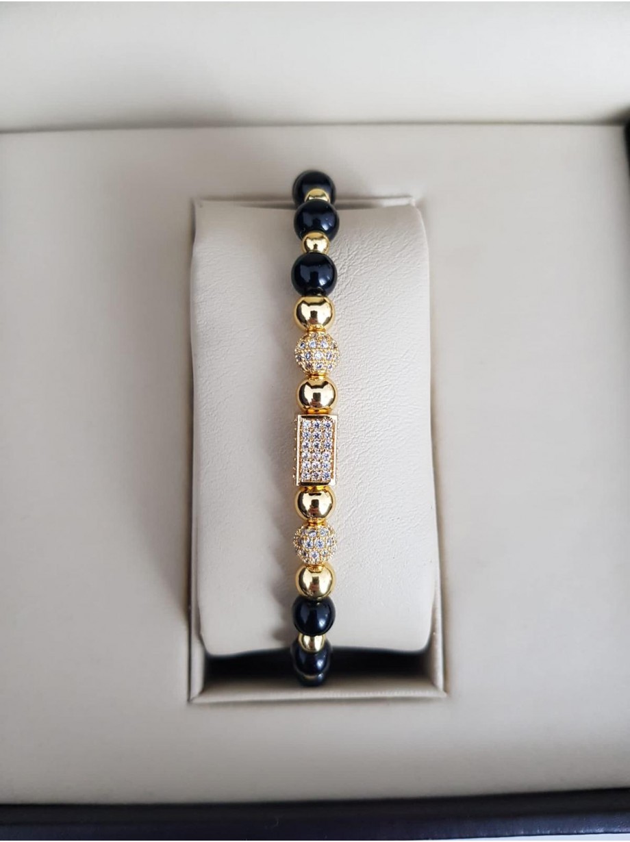 Bratara dama model deosebit cu margele aurii si negre si forme cu pietricele stralucitoare