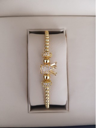 Bratara dama model deosebit cu margele aurii si coroana cu pietricele stralucitoare