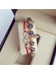 Set 2 Bratari Elegante infinit cu snur rosu si margele bleumarin cu detalii aurii 