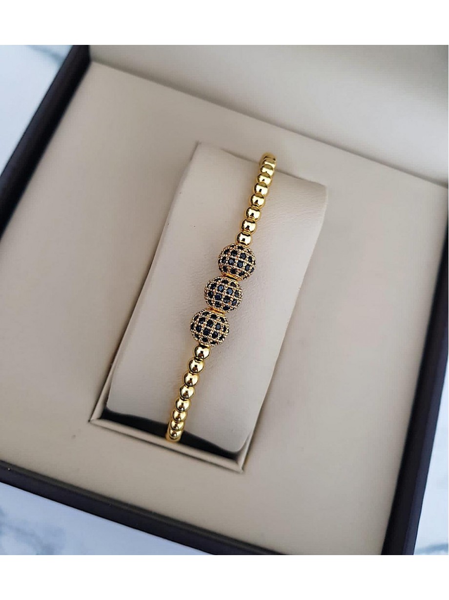 Bratara dama aurie model deosebit cu 3 margele aurii si pietricele negre