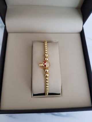 Bratara dama model deosebit cu margele aurii si skull cu pietricele stralucitoare