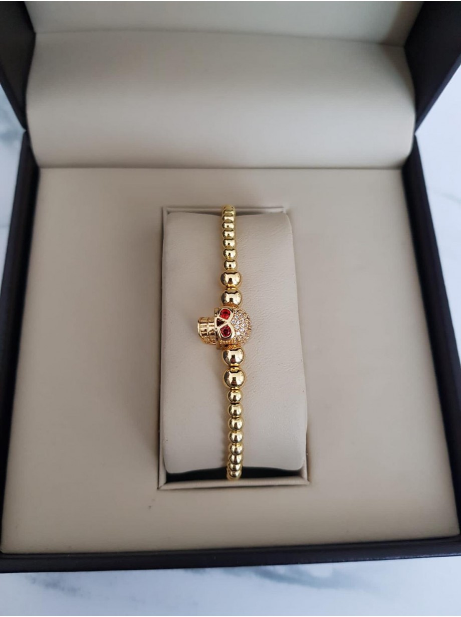 Bratara dama model deosebit cu margele aurii si skull cu pietricele stralucitoare