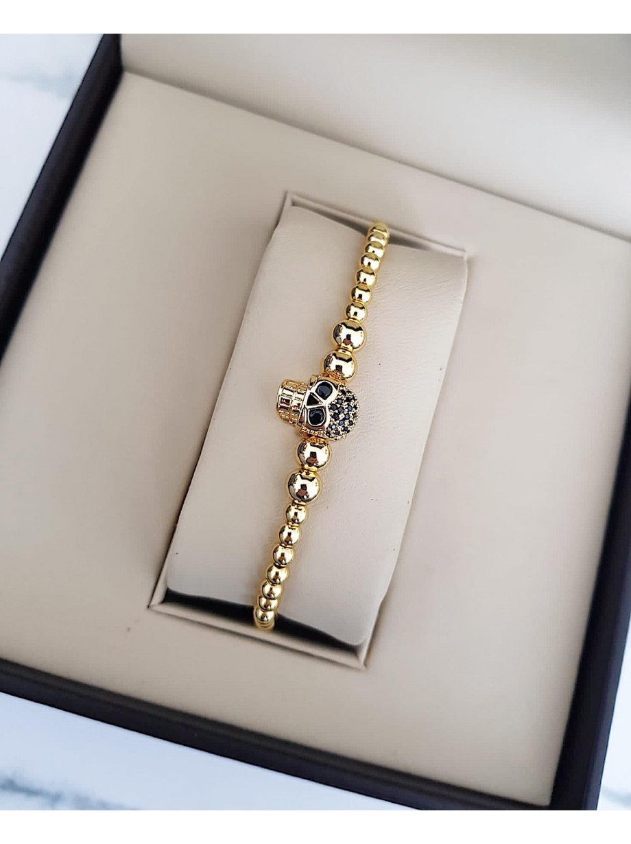 Bratara dama model deosebit cu margele aurii si skull cu pietricele negre