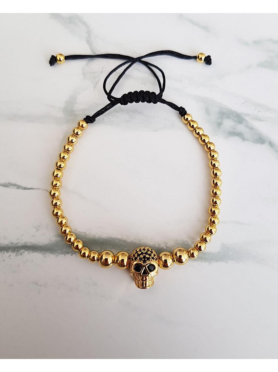 Bratara dama model deosebit cu margele aurii si skull cu pietricele negre