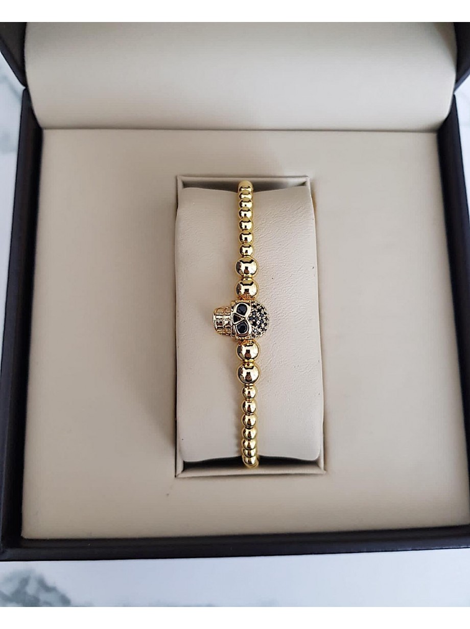 Bratara dama model deosebit cu margele aurii si skull cu pietricele negre