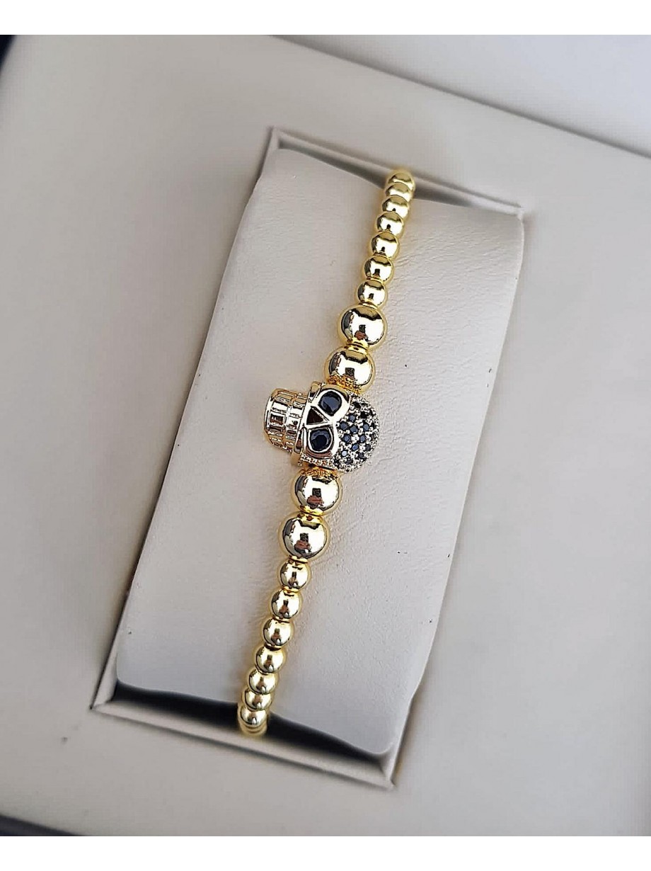 Bratara dama model deosebit cu margele aurii si skull cu pietricele negre