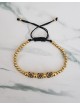 Bratara dama model deosebit cu margele aurii si 3 romburi cu pietricele negre