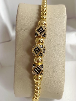 Bratara dama model deosebit cu margele aurii si 3 romburi cu pietricele negre