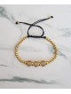 Bratara dama model deosebit cu margele aurii si cercuri cu pietricele stralucitoare