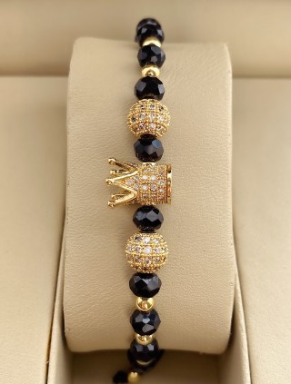 Bratara dama model deosebit cu margele aurii si negre si coroana cu pietricele albe