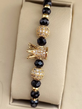 Bratara dama model deosebit cu margele aurii si negre si coroana cu pietricele albe