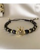 Bratara dama model deosebit cu margele negre si coroana cu pietricele negre