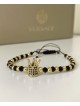 Bratara dama model deosebit cu margele negre si coroana cu pietricele negre