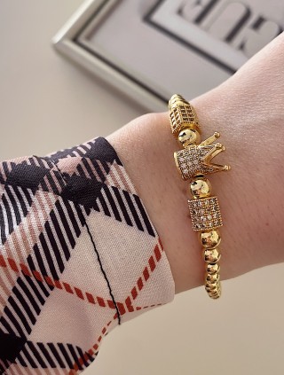 Bratara dama model deosebit cu margele aurii si coroana cu pietricele stralucitoare