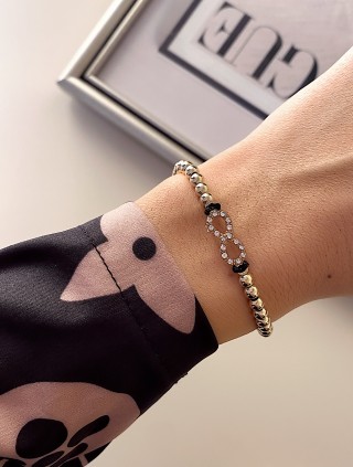 Bratara dama model deosebit cu margele aurii si infinit cu pietricele stralucitoare