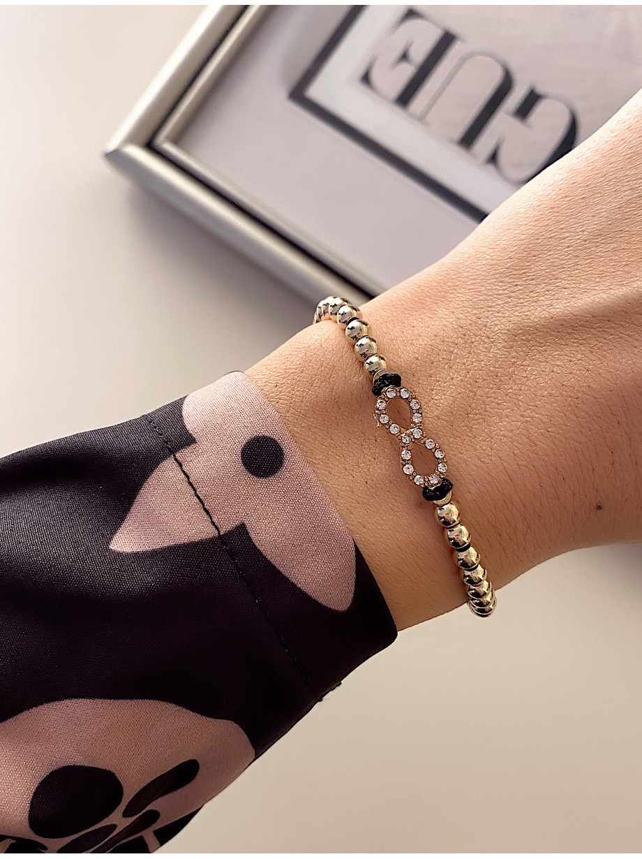 Bratara dama model deosebit cu margele aurii si infinit cu pietricele stralucitoare