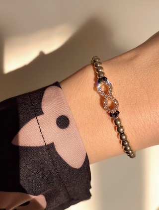 Bratara dama model deosebit cu margele aurii si infinit cu pietricele stralucitoare