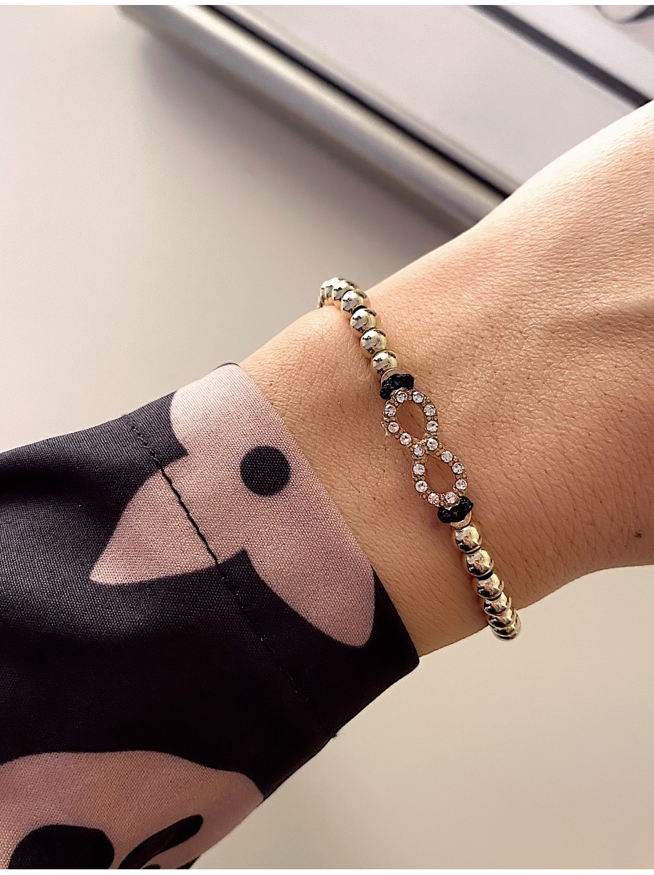 Bratara dama model deosebit cu margele aurii si infinit cu pietricele stralucitoare