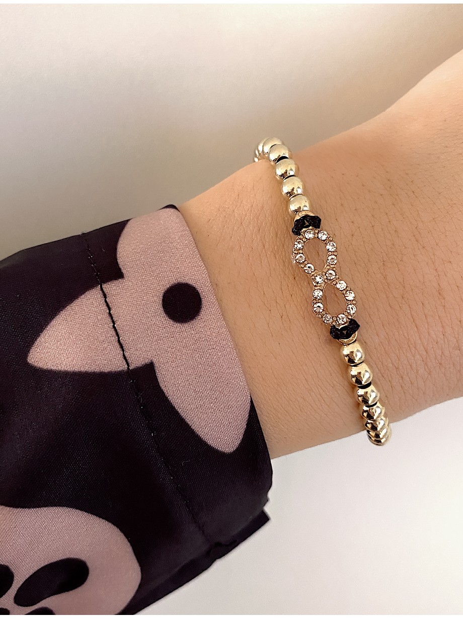 Bratara dama model deosebit cu margele aurii si infinit cu pietricele stralucitoare