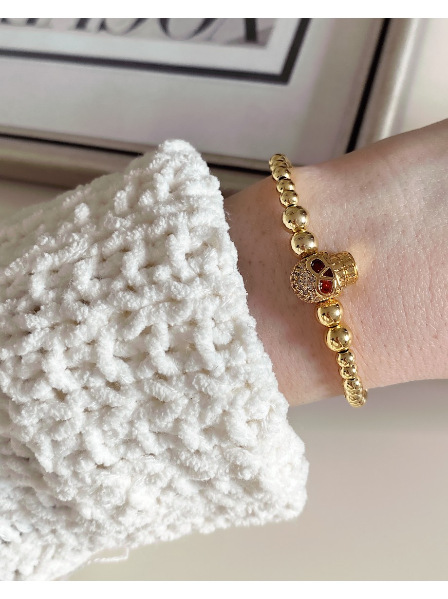 Bratara dama model deosebit cu margele aurii si craniu auriu