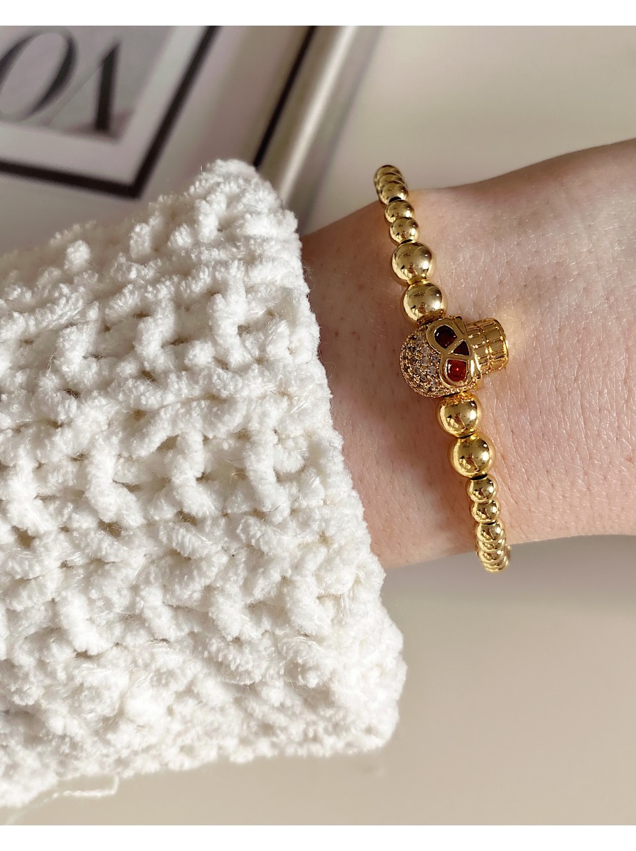 Bratara dama model deosebit cu margele aurii si craniu auriu