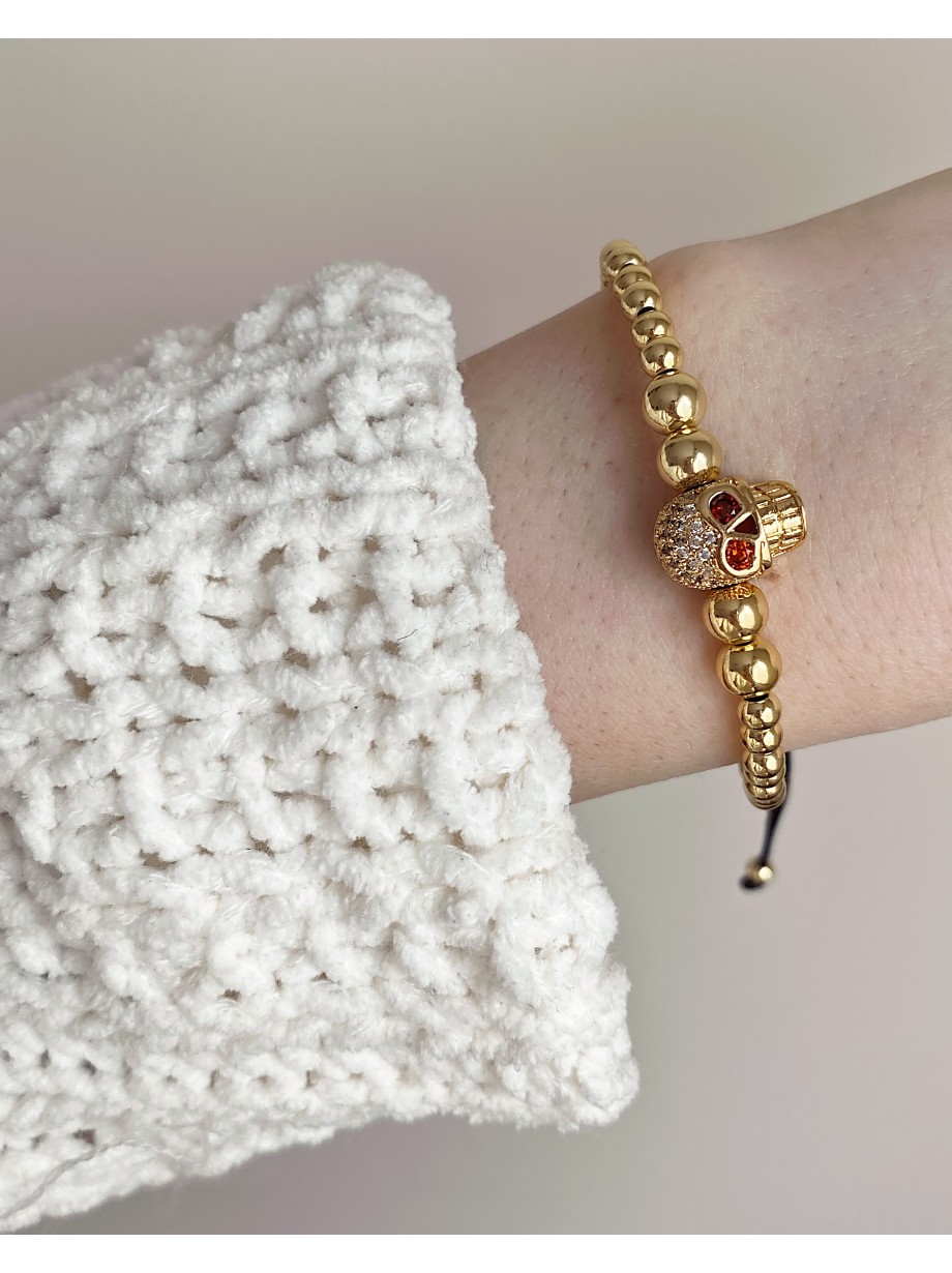 Bratara dama model deosebit cu margele aurii si craniu auriu