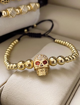 Bratara dama model deosebit cu margele aurii si craniu auriu