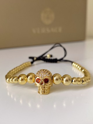 Bratara dama model deosebit cu margele aurii si craniu auriu