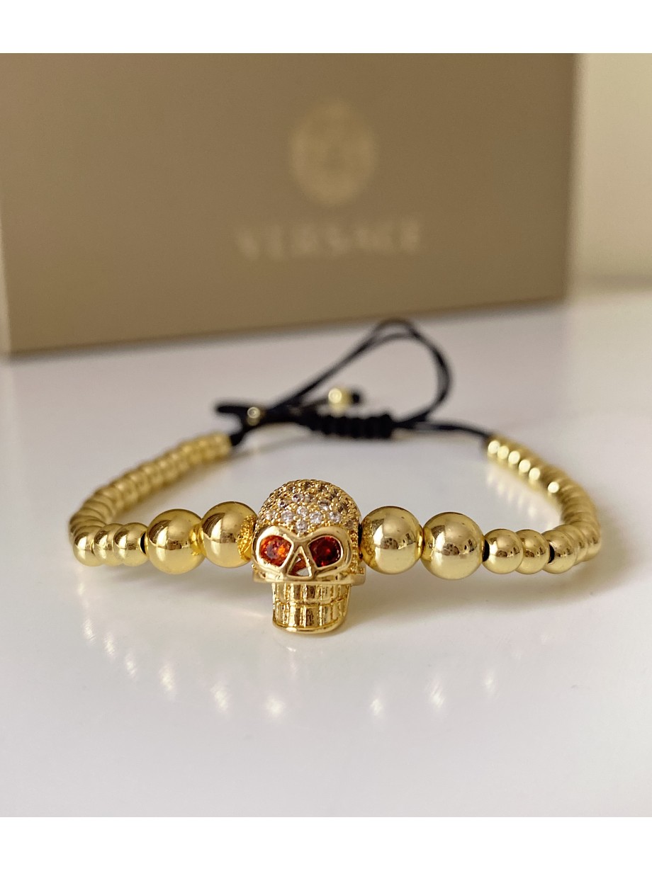 Bratara dama model deosebit cu margele aurii si craniu auriu