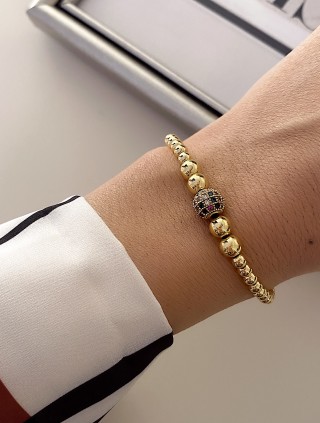 Bratara dama model deosebit cu margele aurii si biluta cu pietricele verzi