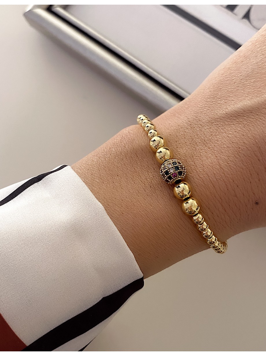 Bratara dama model deosebit cu margele aurii si biluta cu pietricele verzi