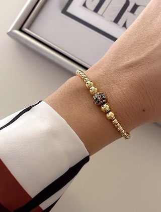 Bratara dama model deosebit cu margele aurii si biluta cu pietricele verzi