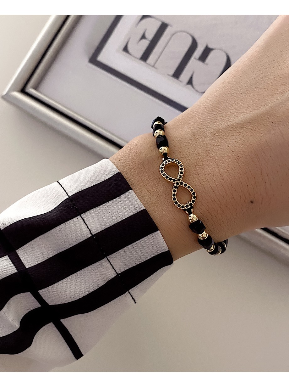 Bratara dama model deosebit cu margele negre cu auriu si infinit cu pietricele stralucitoare