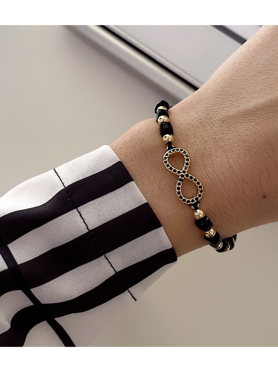 Bratara dama model deosebit cu margele negre cu auriu si infinit cu pietricele stralucitoare