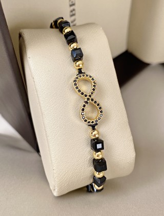 Bratara dama model deosebit cu margele negre cu auriu si infinit cu pietricele stralucitoare