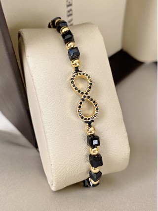 Bratara dama model deosebit cu margele negre cu auriu si infinit cu pietricele stralucitoare