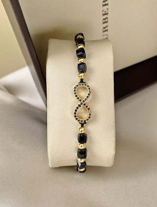 Bratara dama model deosebit cu margele negre cu auriu si infinit cu pietricele stralucitoare