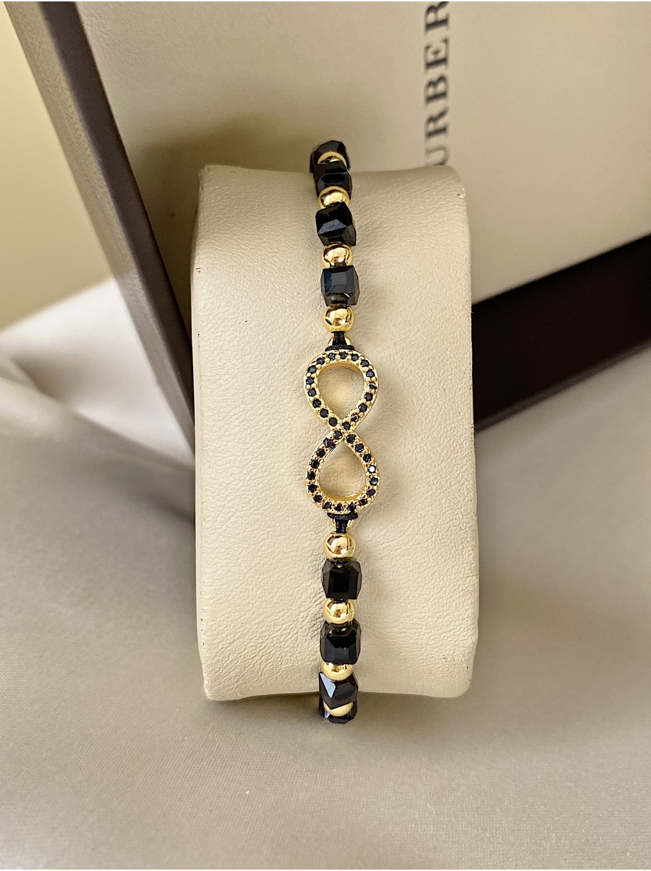 Bratara dama model deosebit cu margele negre cu auriu si infinit cu pietricele stralucitoare