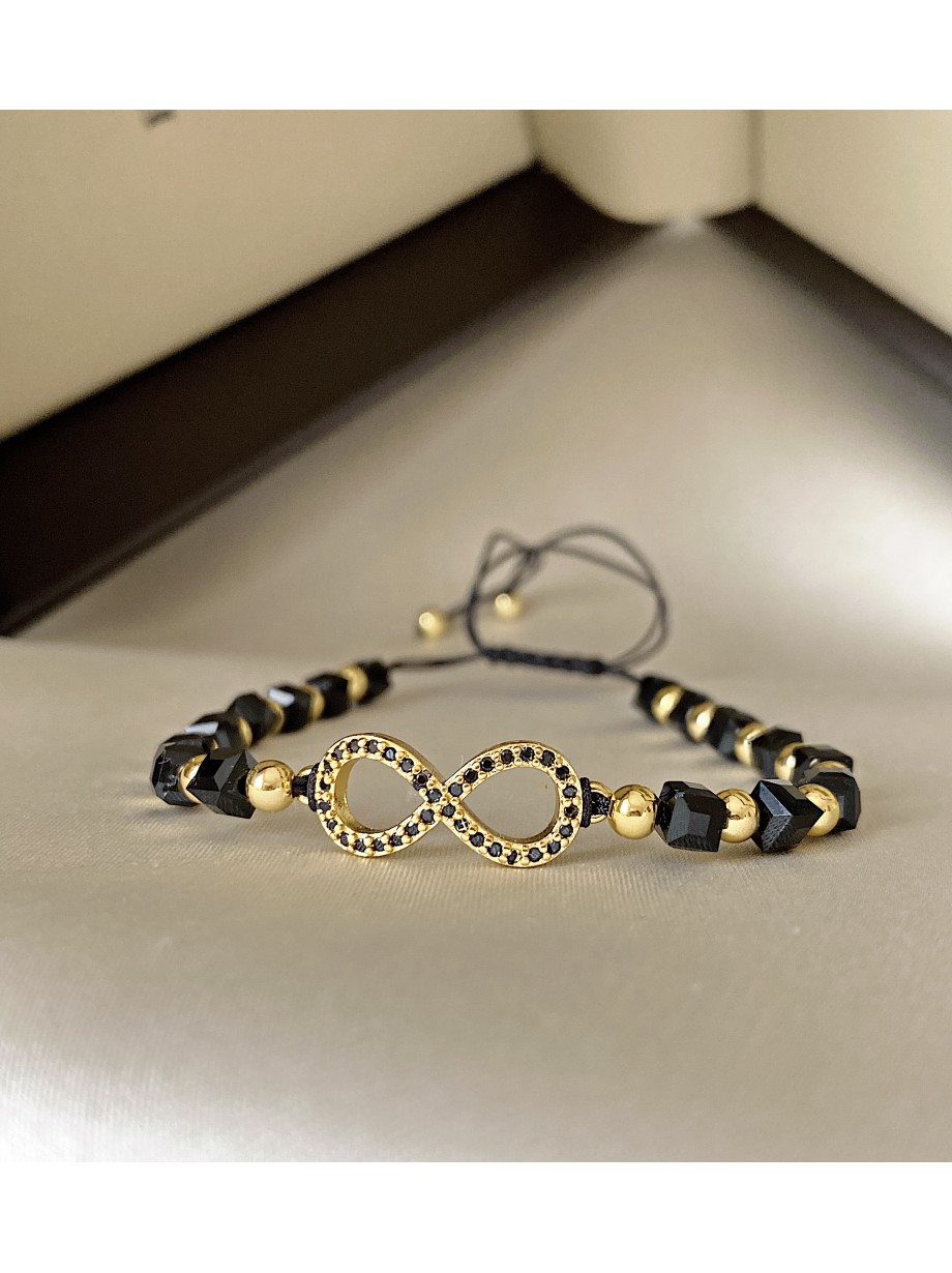 Bratara dama model deosebit cu margele negre cu auriu si infinit cu pietricele stralucitoare