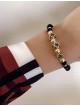 Bratara dama model deosebit cu margele negre cu auriu si 3 romburi cu pietricele negre