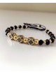 Bratara dama model deosebit cu margele negre cu auriu si 3 romburi cu pietricele negre
